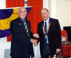 Lion Ian Skinner (on left) hands over the Club Presidency to Lion Chris Rignall on 25th June 2011