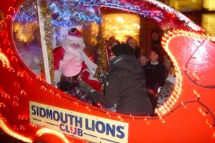 Santa greets some young visitors to Santa\\\'s float at the Sidmouth Late Night Shopping event - 3 December 2010